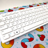 Light blue desk mat patterned with gummy candies
