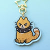 keychain of an orange tabby cat wearing a spiked collar