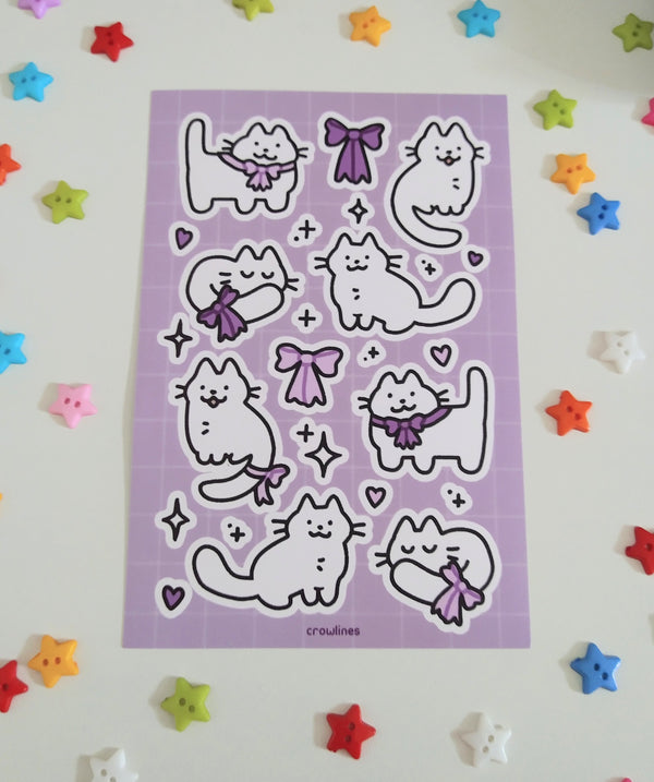sticker sheet of white cats wearing cute purple ribbon bows