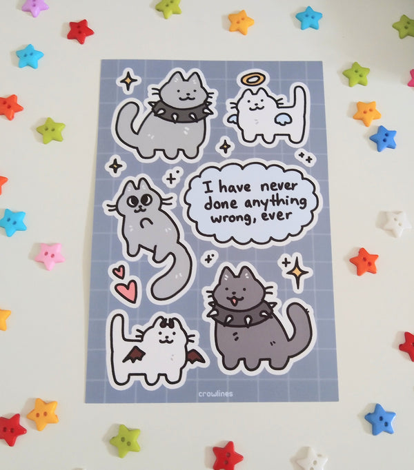 sticker sheet of cats dressed with angel halo and wings and devil horns and wings, some with spiked collars. speech bubble reads