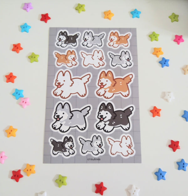 sticker sheet featuring black, gray, red, and white huskies drawn in a cute style