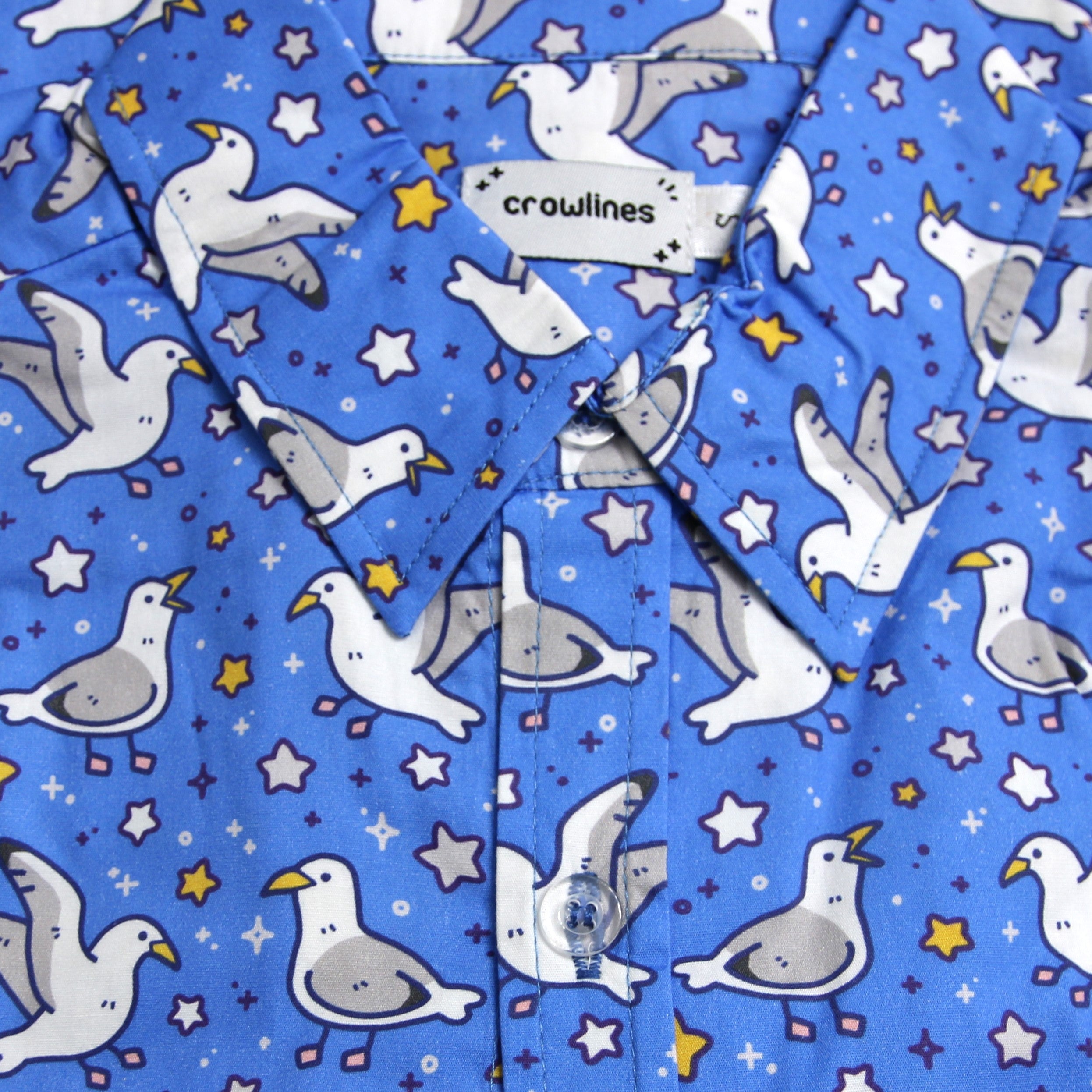 blue button up shirt patterned with seagulls and stars, by crowlines