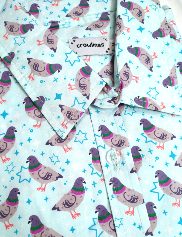 light blue button up shirt patterned with pigeons and sparkles