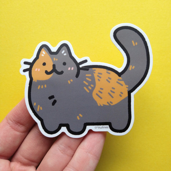 Vinyl sticker of a tortoiseshell cat drawn in a simple cute style