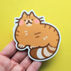 Vinyl sticker of an orange tabby cat drawn in a simple cute style
