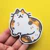 Sticker of a calico cat draw in a kawaii style
