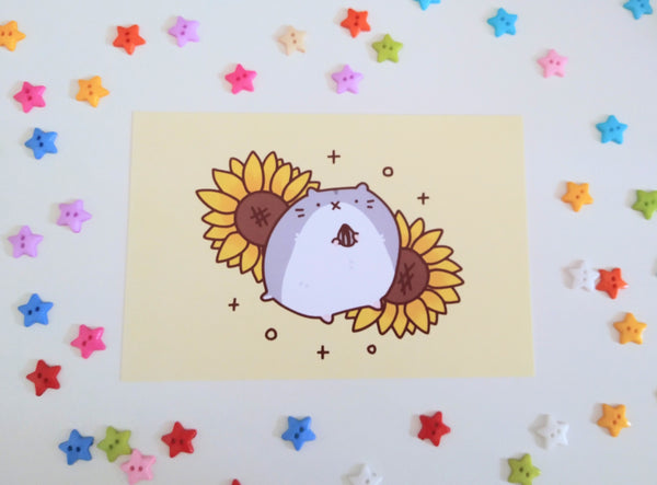 postcard mini print of a cute hamster holding a sunflower seed, with sunflowers in the background