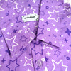 purple button up shirt patterned with sparkles and stars