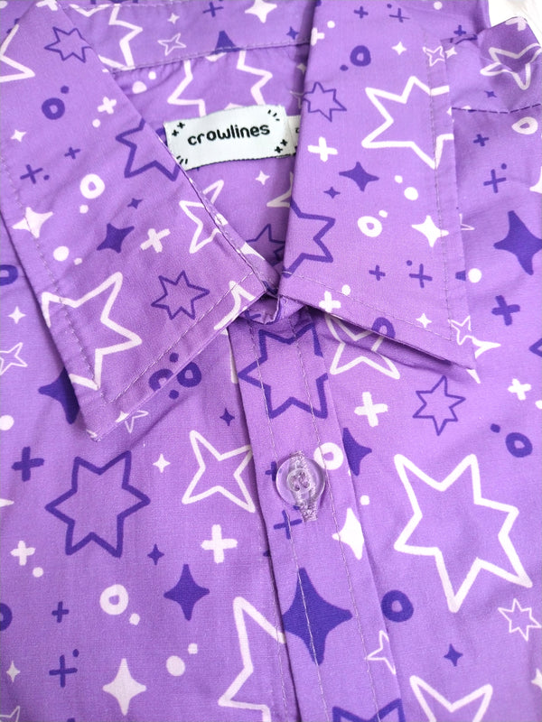 purple button up shirt patterned with sparkles and stars