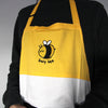 Color block apron with yellow, white, and black cotton. Embroidered with cute round bee with text "busy bee"