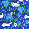 blue button up shirt patterned with white cats and forget me not flowers