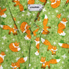 green button up shirt patterned with red foxes and sparkles