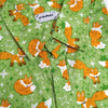 green button up shirt patterned with red foxes and sparkles
