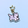 Clear acrylic charm. Grey husky or gray husky keychain with golden star shaped clasp on a light blue background