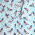 light blue button up shirt patterned with pigeons and sparkles