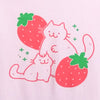 Pink t-shirt screen printed with graphic of two cats. The bigger cat is petting the smaller cat's head. They are surrounded by strawberries and sparkles.