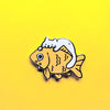 Gold plated hard enamel pin of a white cat munching on a big goldfish