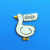 Gold plated hard enamel pin of a goose with speech bubble "HONK"